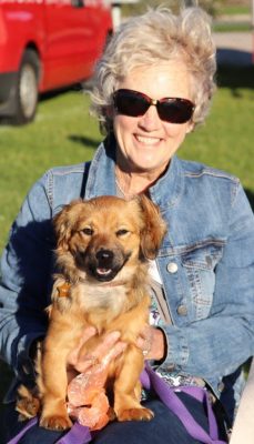 Smiling Woman Holding Dog